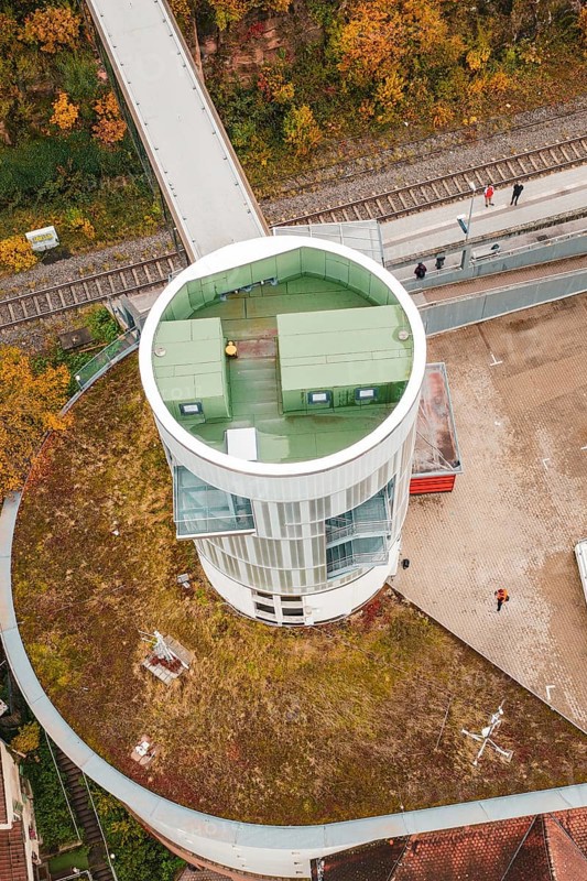 Detailed view of a tower with a green roof and walkers, Hermann Hessebahn, ZOB Calw, Germany