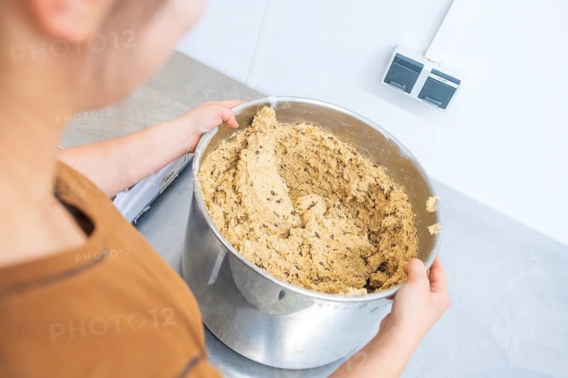 Person holding large bowl of dough in kitchen, preparing for baking, Christmas baking, Haselstaller Hof, Wildberg, Germany
