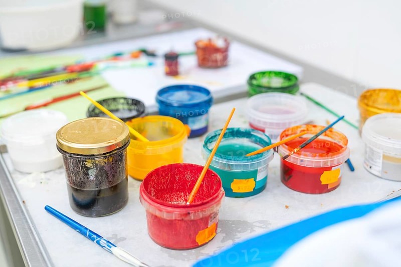 Colourful painting supplies on a table with coloured containers and brushes, Christmas baking, Haselstaller Hof, Wildberg, Germany