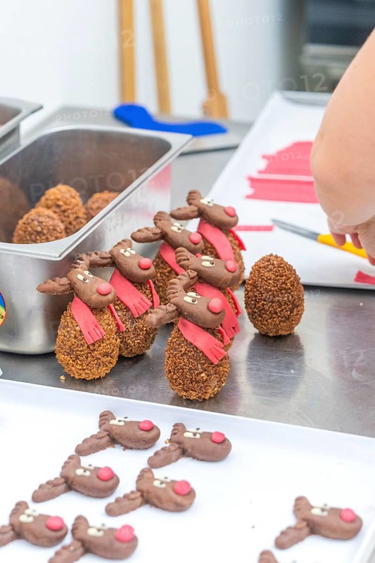 Placement of reindeer shaped chocolate chocolates on a work table, Christmas baking, Haselstaller Hof, Wildberg, Germany
