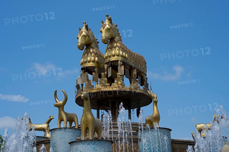 An impressive fountain with golden horse and ram statues under clear skies, Colchis Fountain, David Aghmashenebeli Central Square, Kutaisi, Imereti Region, Georgia
