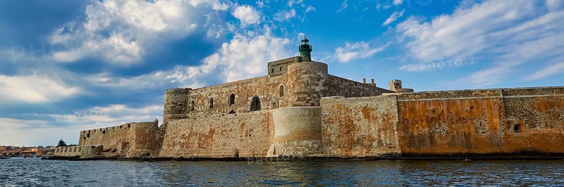 Syracuse, Ortigia island, mighty fortress overlooking the sea under a partly cloudy sky, Baroque towns of Sicily, Baroque corner of Sicily, late Baroque towns of Val di Noto, UNESCO World Heritage Site, Sicily, Italy