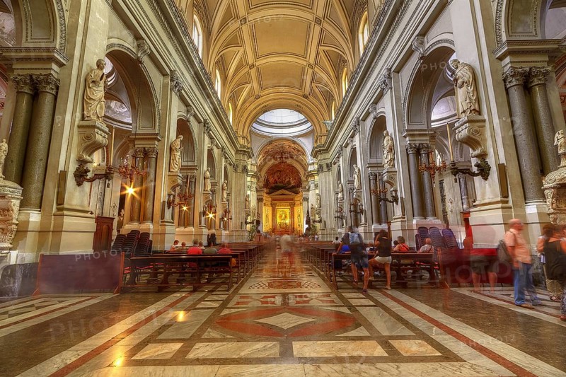 Magnificent church interior with high vaults and sculptures, enlivened by lights and visitors, Palermo, cathedral, UNESCO World Heritage Site, Sicily, Italy