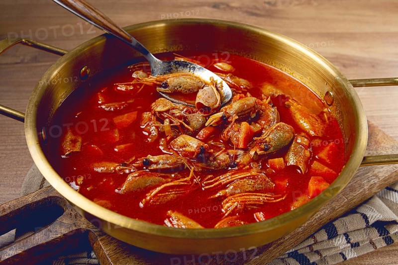 French shrimp bisque soup, in a pot, close-up, no people