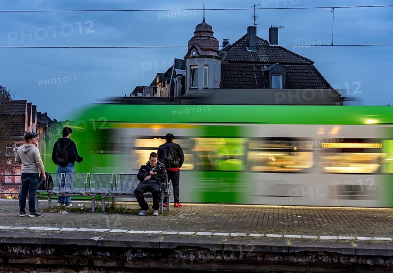 Essen-Steele S-Bahn station, passengers waiting for the train late afternoon, in autumn, Essen, North Rhine-Westphalia, Germany