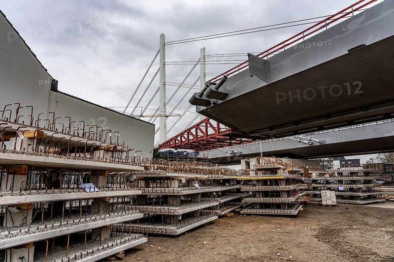 Storage space for building materials at the A40 Neuenkamp bridge, in Duisburg-Homberg, pillars and cables of the new motorway bridge across the Rhine near Duisburg, construction phase of the 2nd bridge structure, North Rhine-Westphalia, Germany