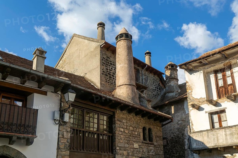 Traditional chimneys medieval village of Echo or Hecho, Valle de Hecho, Pyrenees Mountains, Huesca province, Aragon, Spain