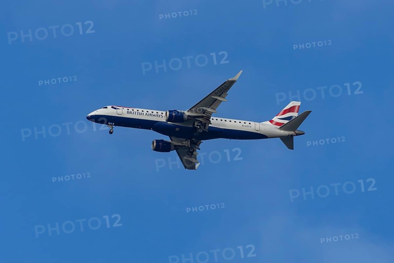 Embraer ERJ-190 jet passenger aircraft of British Airways BA CityFlyer airlines in flight on approach to London city airport, England, United Kingdom