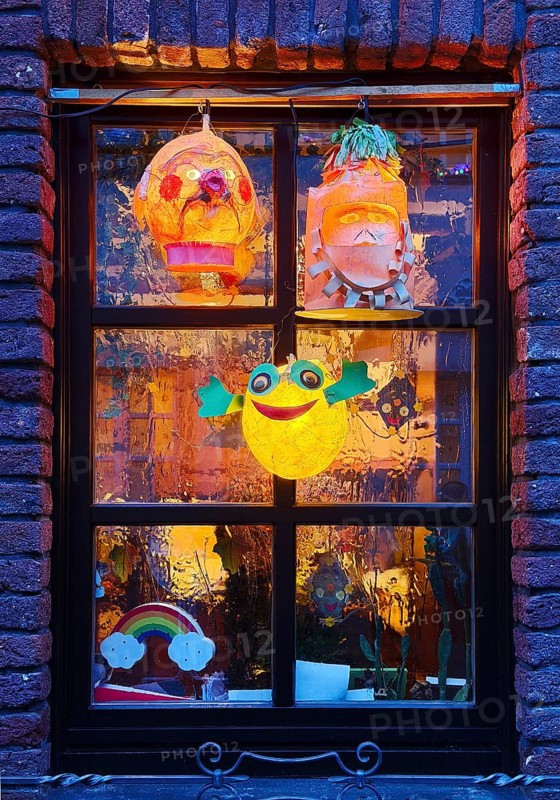 Homemade lanterns for the Martin procession in front of a window in the evening, Old Town, Kempen, Lower Rhine, North Rhine-Westphalia, Germany