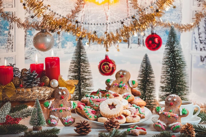 Decorated Christmas table with cookies and festive ornaments