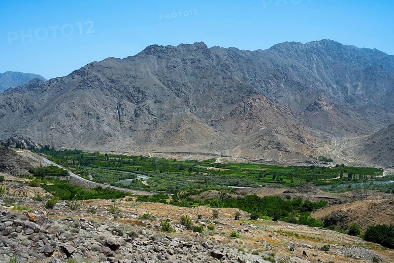 A vast valley with green vegetation surrounded by dry mountains, views of Iran, Aras River near Meghri, Syunik Province, Syunik, Armenia