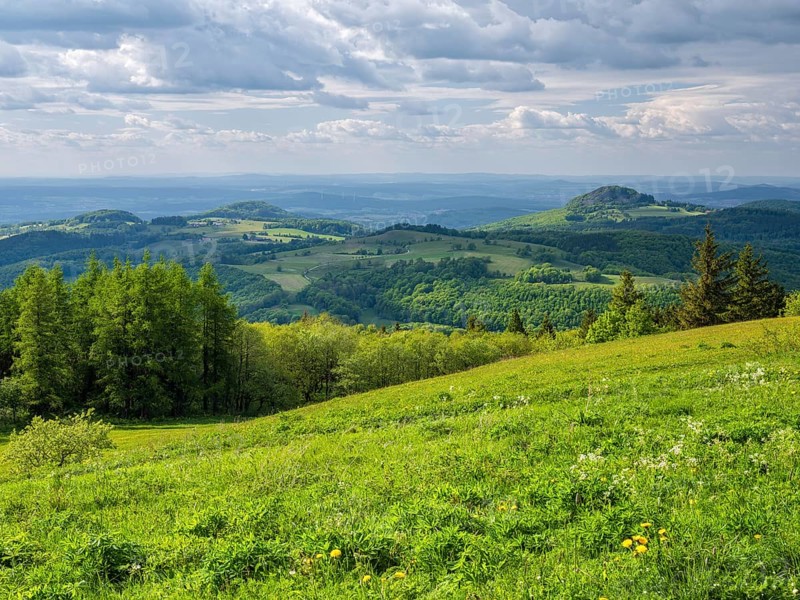 View from the summit of the Wasserkuppe over the hills of the Rhön to Milseburg, Gersfeld, Hesse, Germany