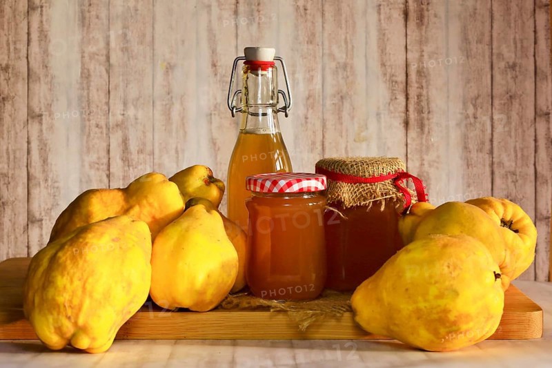 Still life with quinces, homemade quince jelly and quince liqueur, autumn, Germany