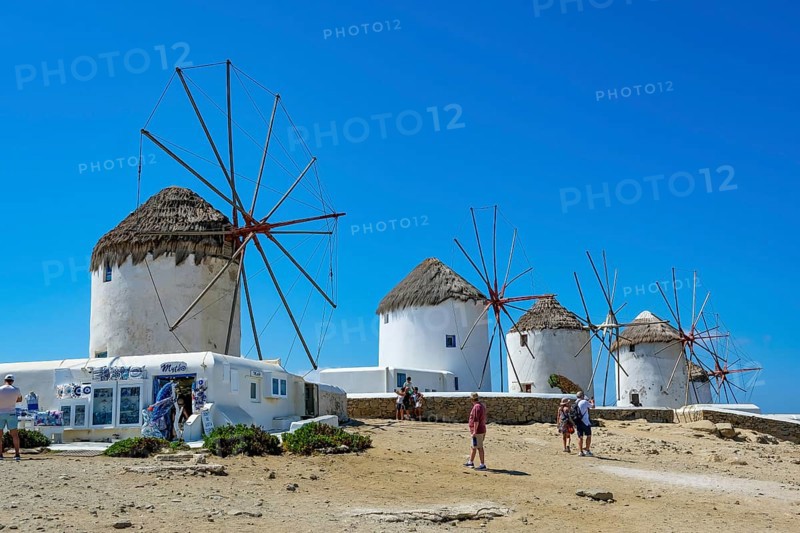 Mykonos, Cyclades, Greece - The six sixteenth-century windmills, lined up on a hill above Mykonos Town, Mykonos Chora, are the island's landmark. Mykonos is part of the Cyclades archipelago in the Aegean Sea
