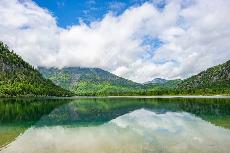 Landscape of Lake Offensee after rain when the sun comes through the clouds in spring, Salzkammergut, Austria