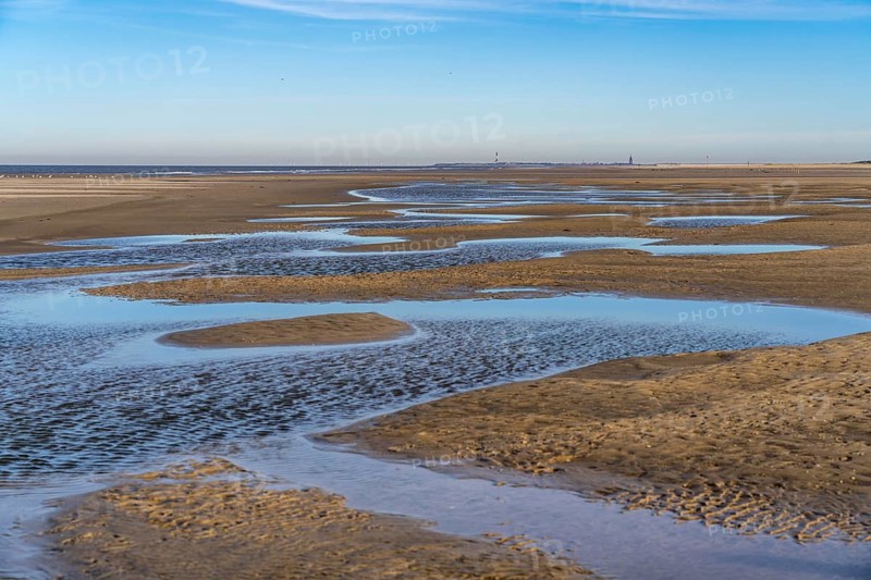 East beach of the East Frisian island of Spiekeroog, at low tide, tidal creek, watercourse at low tide, looking east towards the island of Wangerooge, Lower Saxony, Germany
