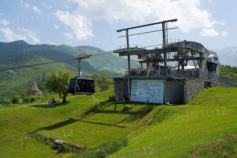 Cable car station on a green hill with views of the surrounding mountain landscapes, Tatev cable car, Wings of Tatev, Tatev wing, cable car station in Tatev with Tatev monastery, Syunik province, Caucasus, Armenia