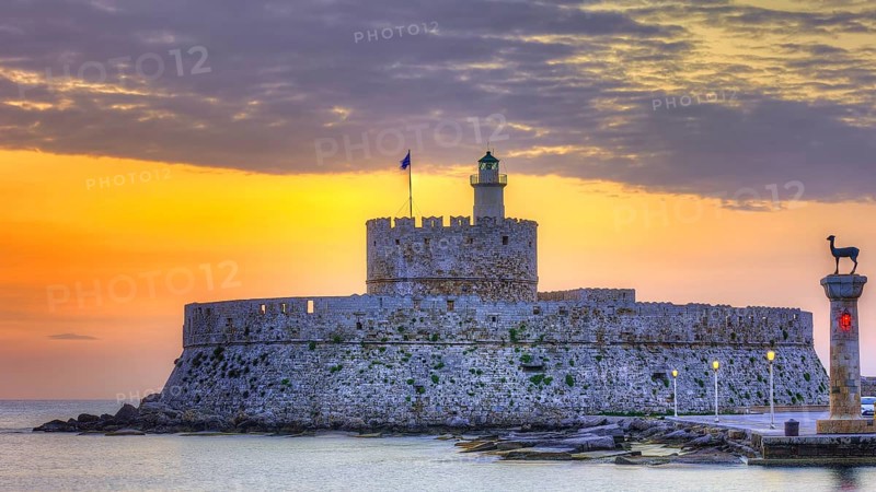 Agios Nikolaos fortress, picturesque castle with lighthouse at sunrise, surrounded by calm sea, UNESCO World Heritage Site, Old Town of Rhodes Town, Rhodes, Dodecanese, Greece