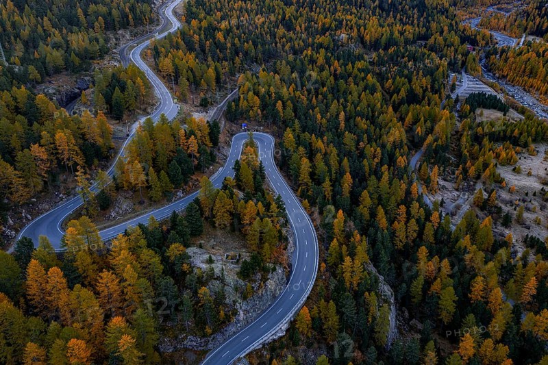 Mountain landscape, road, curvy, serpentines, larch forest, autumn, autumn discoloration, aerial view, Montebello curve, Morteratsch, Engadin, Switzerland