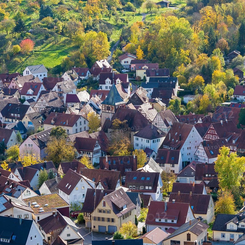 View of a picturesque village with red roofs and autumn trees, Strümpfelbach im Remstal, Baden-Württemberg, Germany