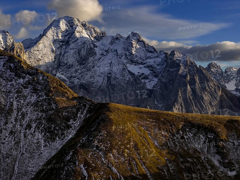 Steep mountains, snowy, mountain range, sunny, wild, autumn, aerial view, Pordoi Pass, view of Marmolada, Dolomites, Italy