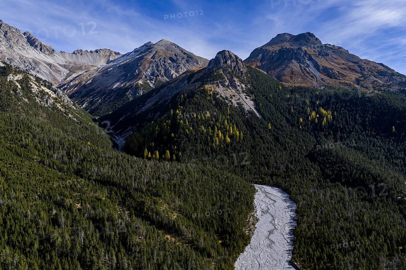 Mountain landscape, wild, untouched, coniferous forest, sunny, riverbed, autumn, aerial view, Val Müstair, Swiss National Park, Switzerland