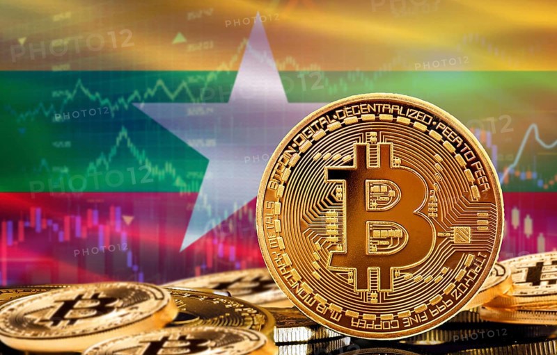 Investors in cryptocurrency and Blockchain Technology in Myanmar, Concept. Bitcoin with Myanmar flag in the background