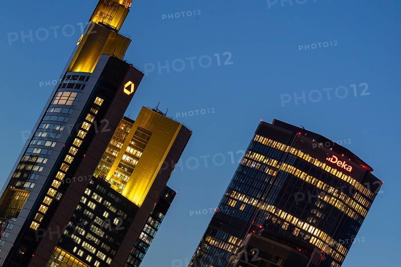The towers of Commerzbank and Deka Bank in Frankfurt am Main light up in the evening, Frankfurt am Main, Hesse, Germany