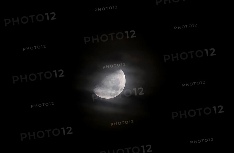 Moon at night behind veil clouds, autumn, Germany