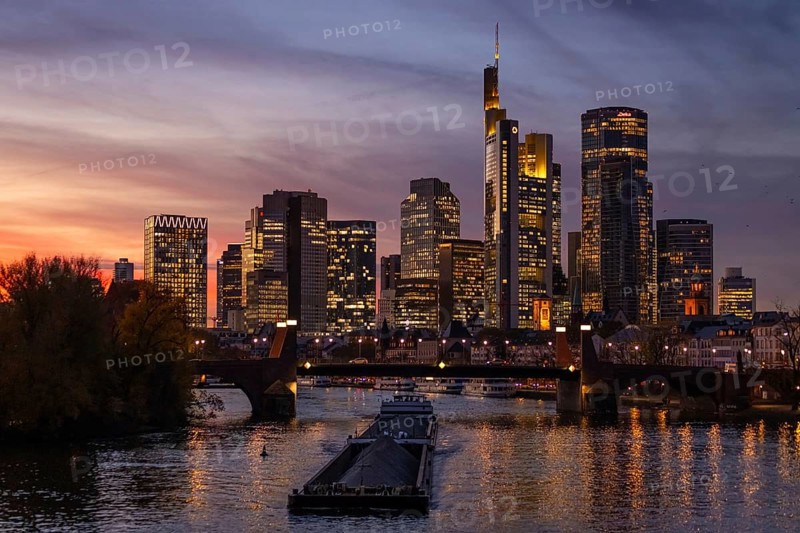 The lights of Frankfurt's banking skyline glow in the evening, Frankfurt, Hesse, Germany