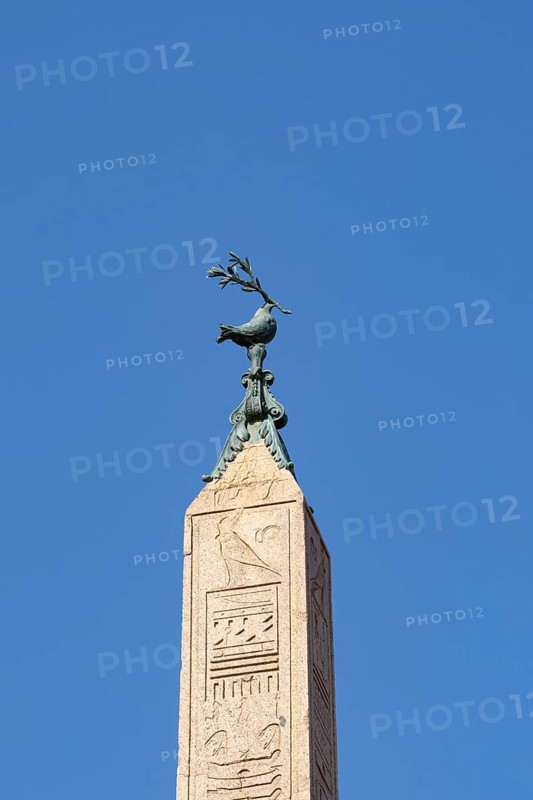 Peace dove bird sculture on the top of a building in the city of Rome, Italy