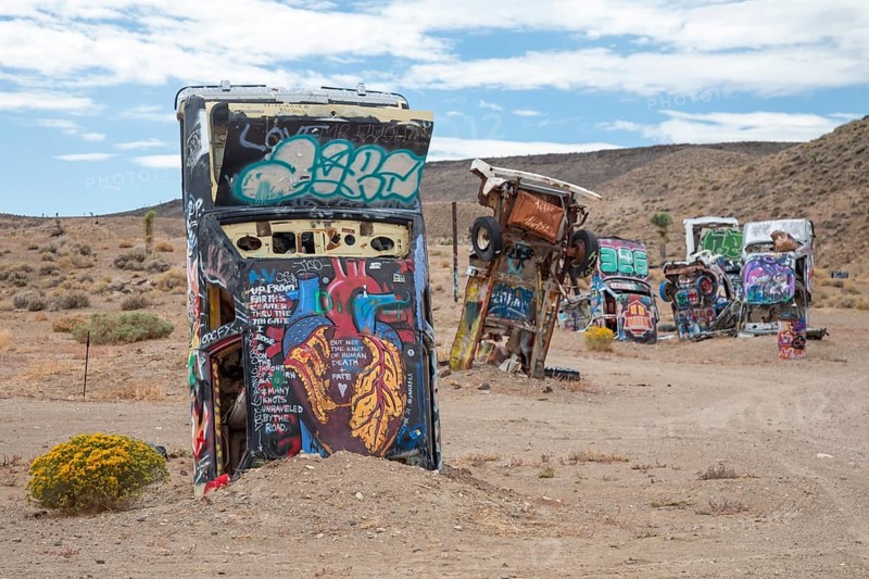 Goldfield, Nevada - The International Car Forest of the Last Church. Artist Mark Rippie has partially buried or decorated several dozen junk cars