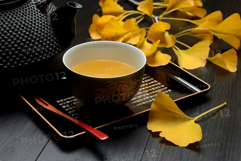 Ginkgo tea in tea bowl and ginkgo leaf, ginkgo biloba