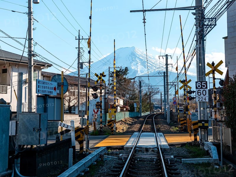 Rails of a railway line, behind Vulkan Mt. Fuji, Fujiyoshida, Yamanashi Prefecture, Japan