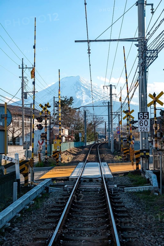 Rails of a railway line, behind Vulkan Mt. Fuji, Fujiyoshida, Yamanashi Prefecture, Japan