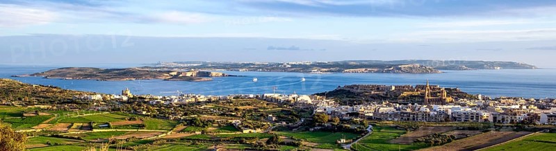 Panoramic view of three islands in the Mediterranean from the state of Malta in front island of Gozo in the middle small island of Comino in the background large island of Malta, Malta