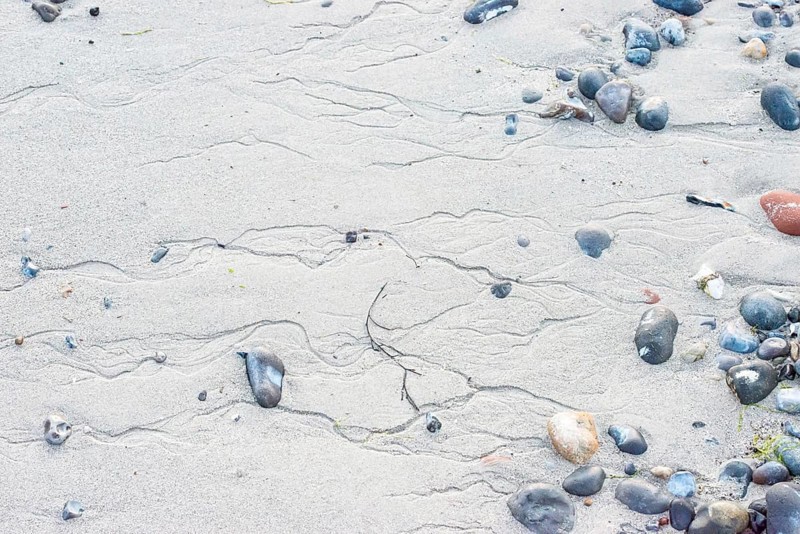 Pattern in sand with scattered stones on a quiet sandy beach, drainage channels, runoff water, gutters, meanders, structure, natural structures, flint, flints, pebbles, beach stones, beach, mudflats at low tide, soft light, atmosphere, shore, detail, close-up, nobody, maritime, deserted, sea, south beach, North Sea, Dune island, Heligoland, Pinneberg District, Schleswig-Holstein, Germany
