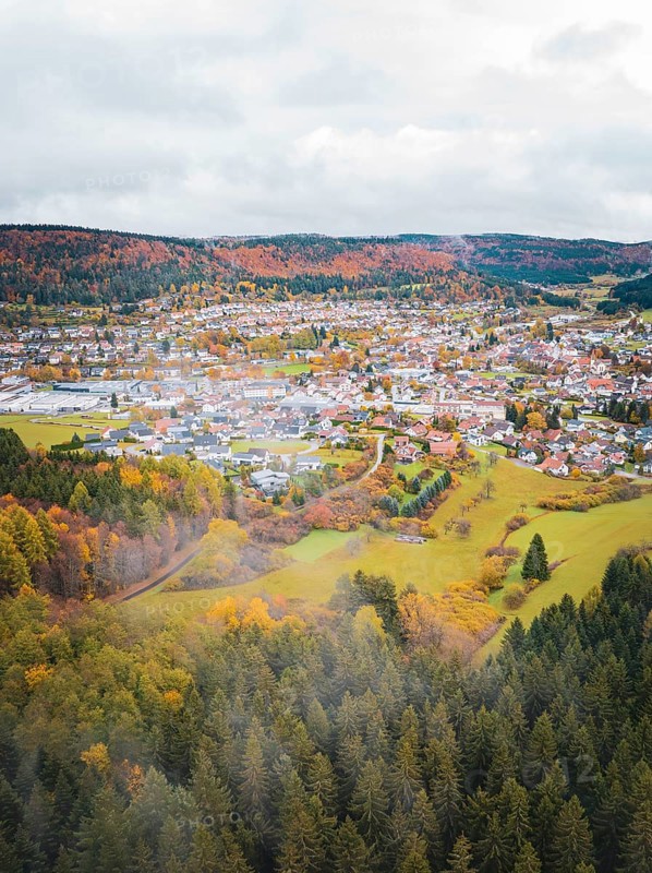 Village surrounded by autumnal landscape with foggy foothills, Wehingen, Tuttlingen district, Germany