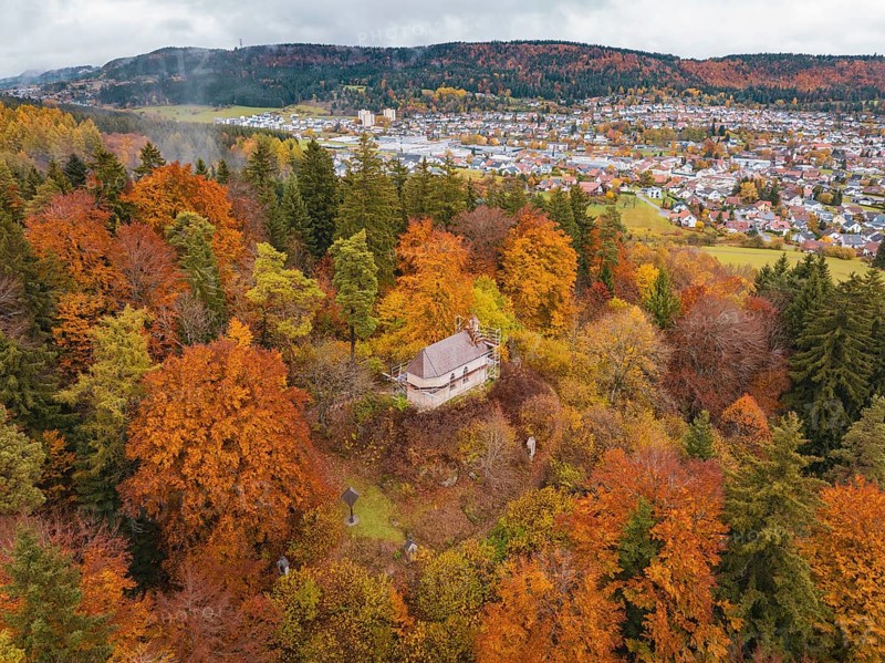 Small platform above a colorful autumn forest, the village in the background, Wehingen, Tuttlingen district, Germany