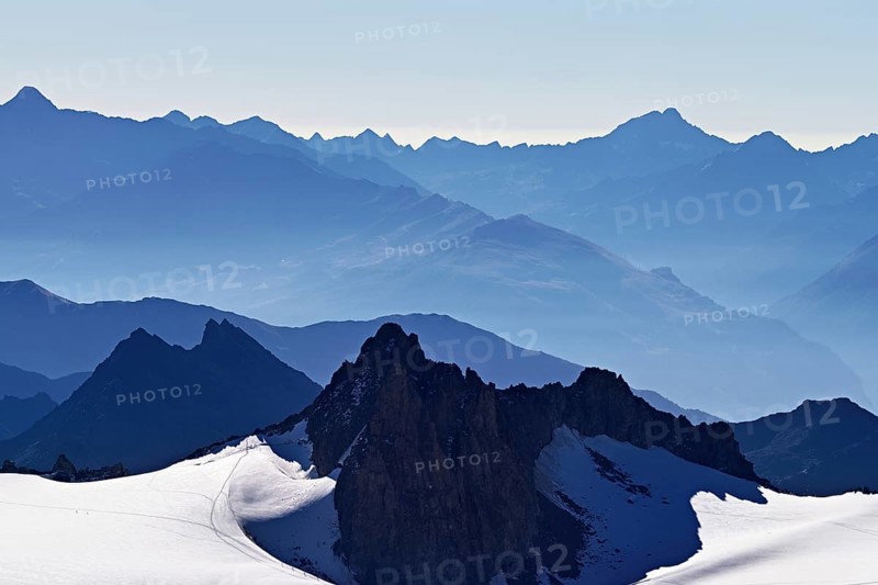 View of the snow-capped mountains from the Aiguille du Midi mountain station observation deck, Chamonix-Mont-Blanc, Haute-Savoie, France