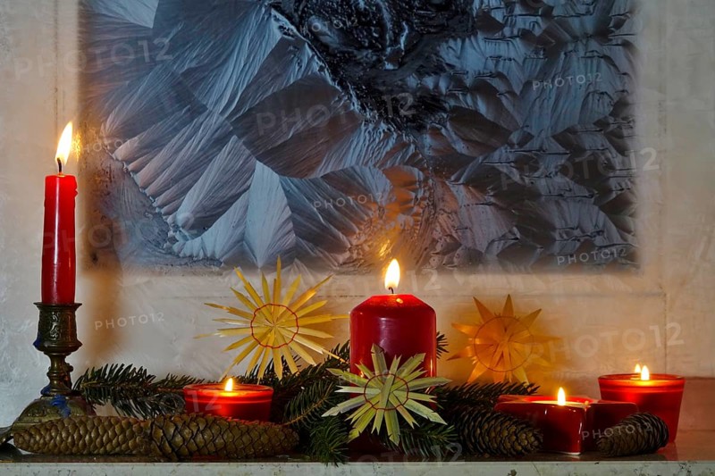 Christmassy decorated iced window, candle light, straw stars, Germany