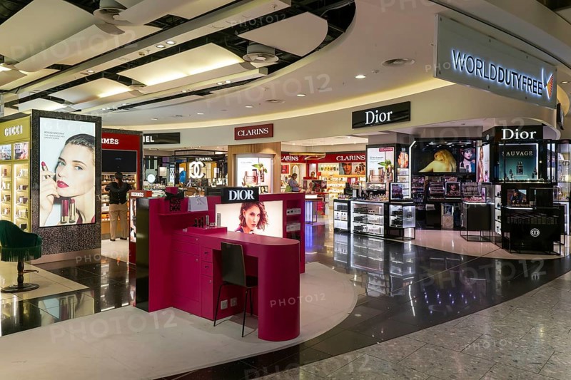 Perfume and cosmetics brands on display Duty Free shopping area in departures lounge area, Terminal 5, London Heathrow airport, London, England, UK