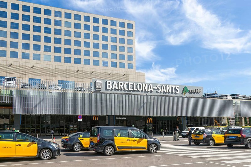 Taxis in street outside Barcelona-Sants railway station building in city centre, Barcelona, Catalonia, Spain