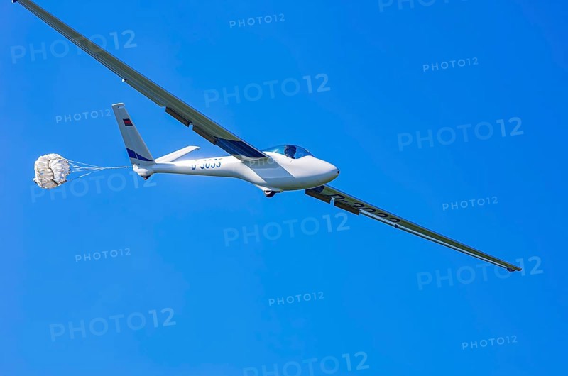 A Hänle H-101 somersault glider, registration D-3033, during a demonstration as part of an air show at the Fliegerbergfest of the Rossfeld Luftsportverein in Metzingen-Glems, Baden-Württemberg, Germany, for editorial use only