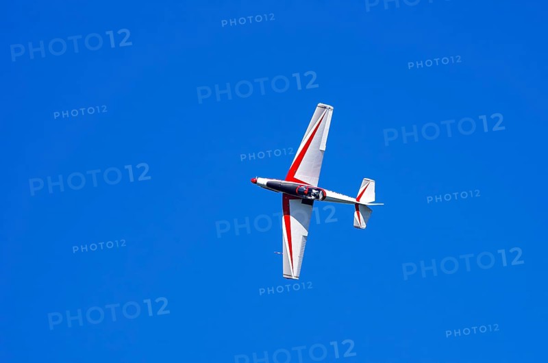 A single-engine aerobatic aircraft during a flight demonstration at the Rossfeld Luftsportverein in Rossfeld in Metzingen-Glems, Baden-Württemberg, Germany, for editorial use only