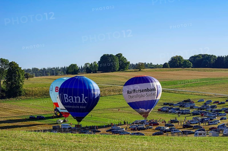 Hot air balloons are being prepared for takeoff as part of an air show at the Fliegerbergfest of the Rossfeld Luftsportverein in Metzingen-Glems, Baden-Württemberg, Germany, for editorial use only