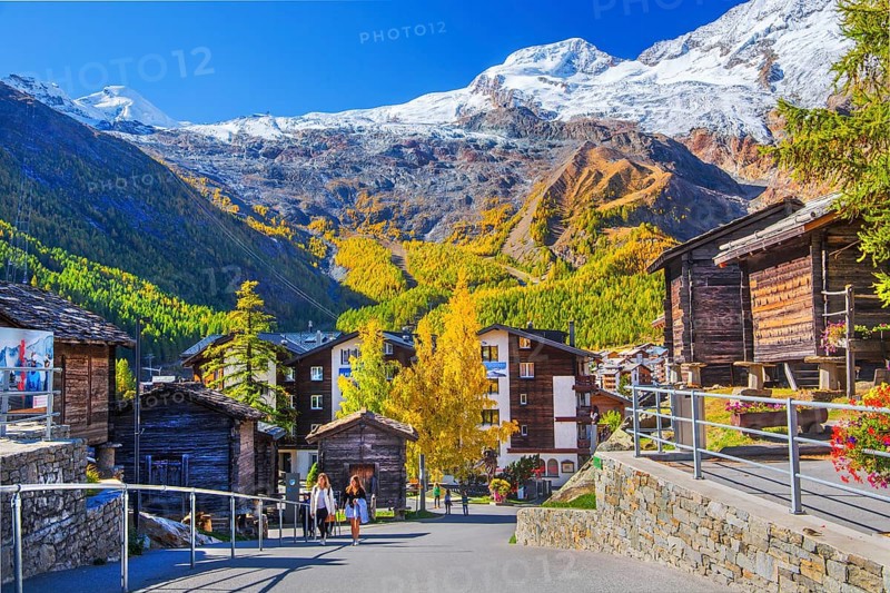 Typical granaries on the outskirts of the village with Allalin 4027m and Alphubel 4206m in autumn, Saas-Fee, Saasertal, Valais, Switzerland