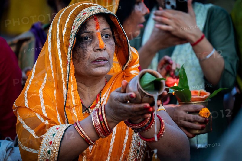 Hindu devotees offer prayers to the Sun God on the bank of Brahmaputra river on the occasion of Chhath Puja, in Guwahati, India on 27 October 2025