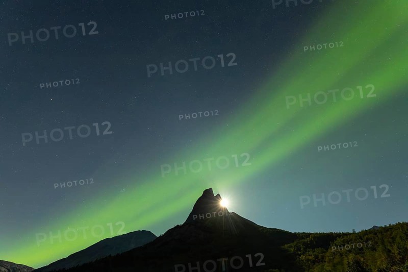 National mountain of Norway - Stetind in the Nordland under auroras and a full moon