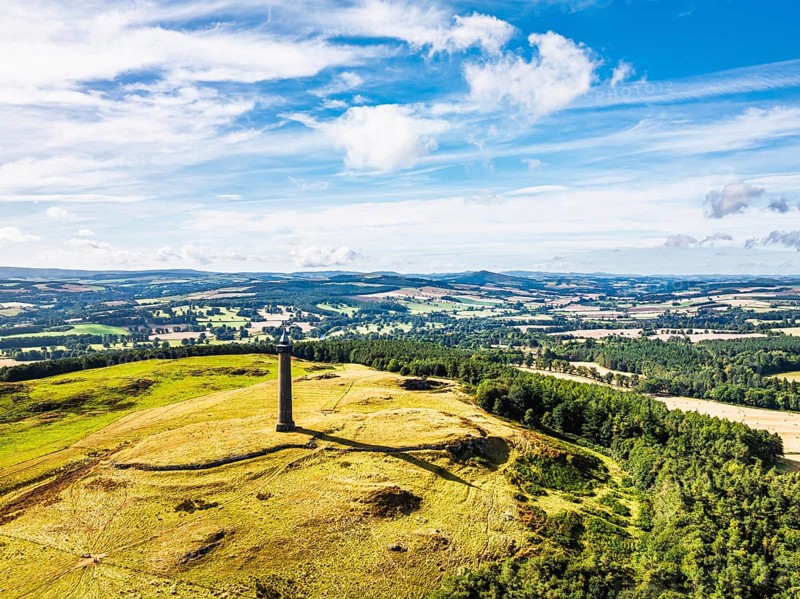 Waterloo Monument over Scottish fields and farms from a drone, Jedburgh, Scotland, UK